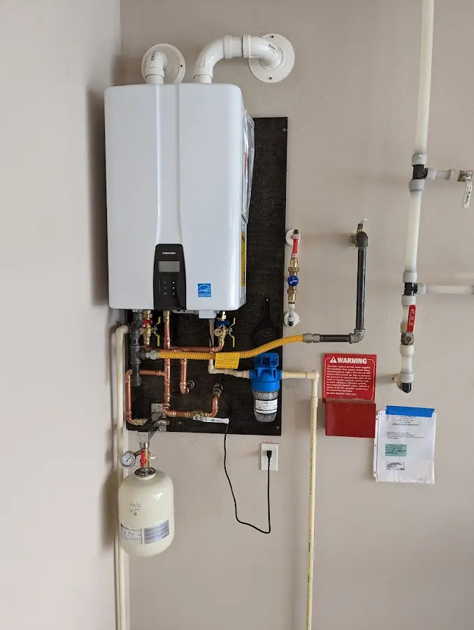 Professional plumber installing copper piping in a Nashville home